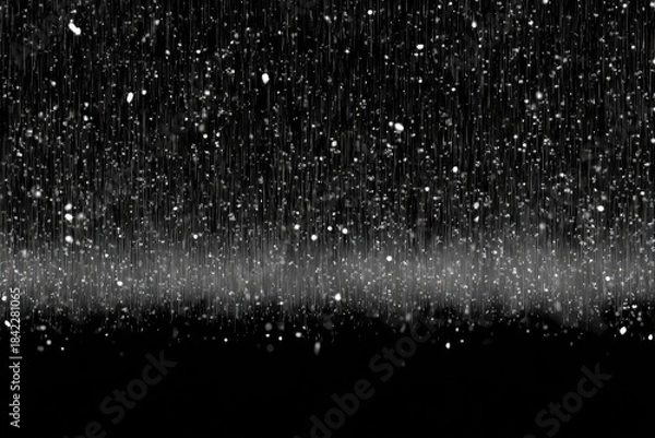 Obraz Abstract grayscale depiction of falling rain and snow against a solid black background