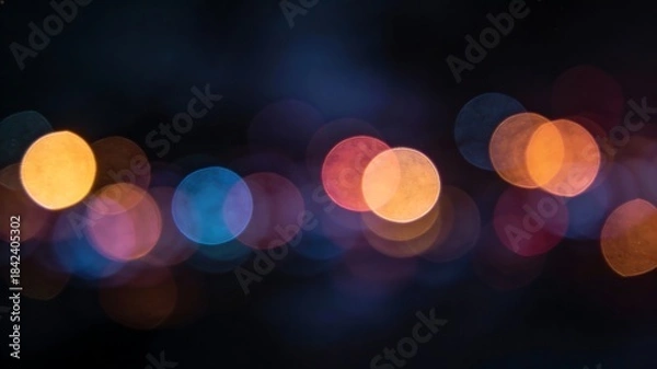 Fototapeta Abstract bokeh lights against a dark background creating a dreamy atmosphere