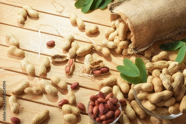 Fototapeta Table with containers filled with freshly picked peanuts elevated view