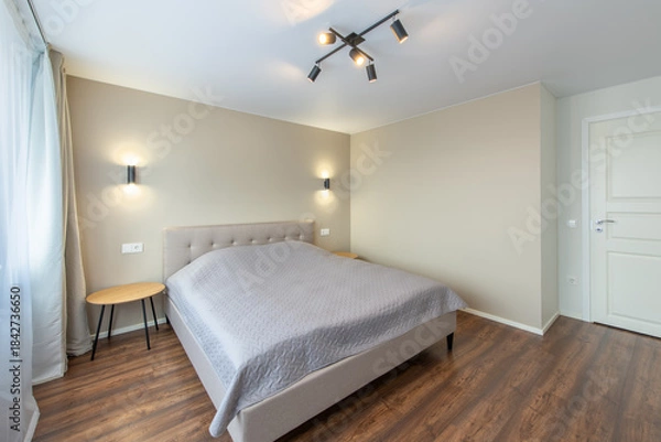 Obraz Minimalism Bedroom Interior. Wardrobe in Background. Coffee Table and Light. Windows and Curtains. Home.