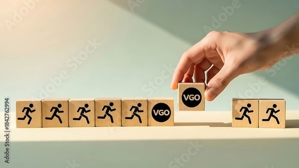 Fototapeta Hand placing final block with yes on running man blocks in a row on a table with green background