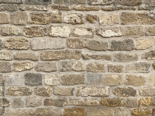 Obraz Background Ancient wall of brown stone closeup