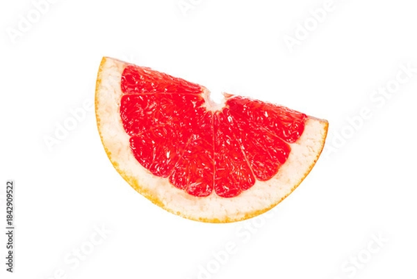 Fototapeta A slice of red grapefruit is shown on a white background