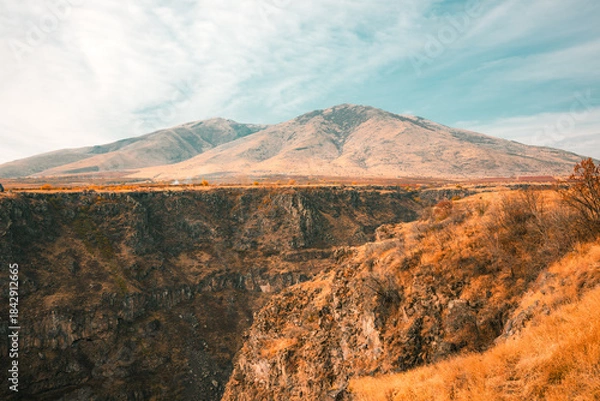 Fototapeta A mountain range with a valley in between