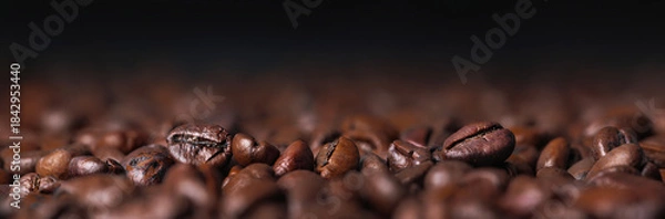 Fototapeta Roasted coffee beans macro with dark background