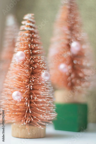 Fototapeta A toy Christmas tree in a soft retro filter, vertical frame