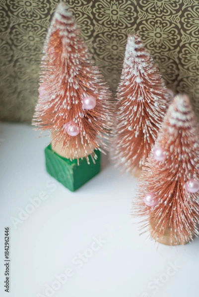 Fototapeta A toy Christmas tree in a vintage soft focus filter, vertical frame