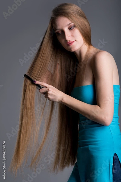 Fototapeta young woman with long beautiful hair