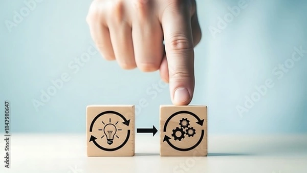 Fototapeta Hand pointing at process block next to idea block with arrow