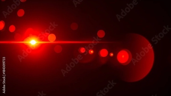 Fototapeta Bright red light source with horizontal lens flare and bokeh elements against a black background