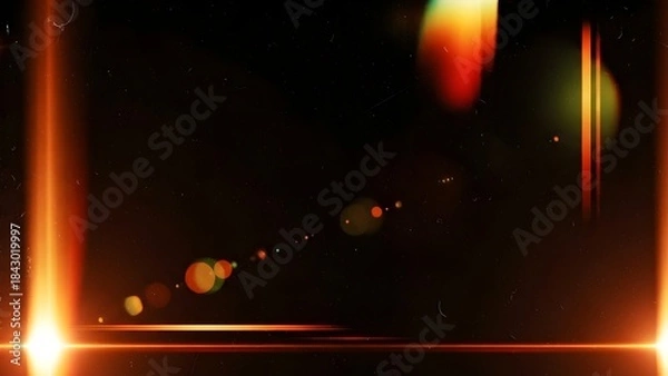 Fototapeta An abstract image featuring glowing orange light leaks and vintage dust particles on a dark background