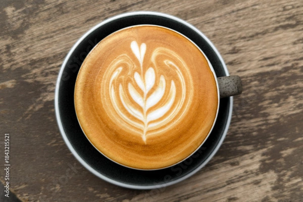 Obraz Hot coffee, a hot latte in a mug on a wooden table.