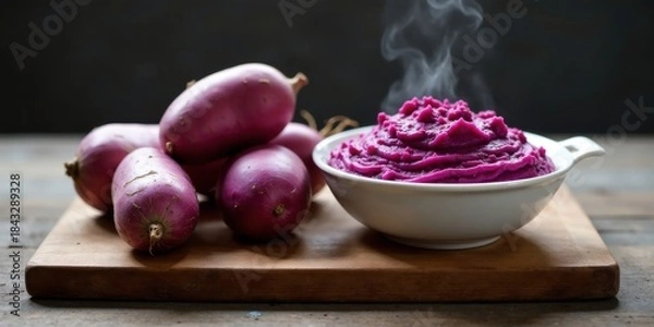 Fototapeta Aromatic Steamed Purple Sweet Potatoes Served in a Bowl with Delicate Mashed Texture on a Rustic Wooden Board