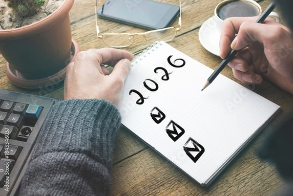 Obraz man writing plan 2026