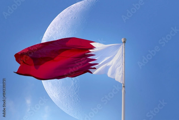 Fototapeta Doha, Qatar- December 10, 2025: Qatar Flag flying high in the wind. National Museum Qatar 