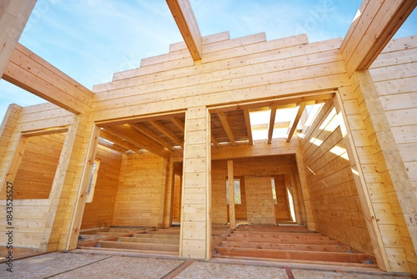 Obraz Building a wooden house on the construction site.