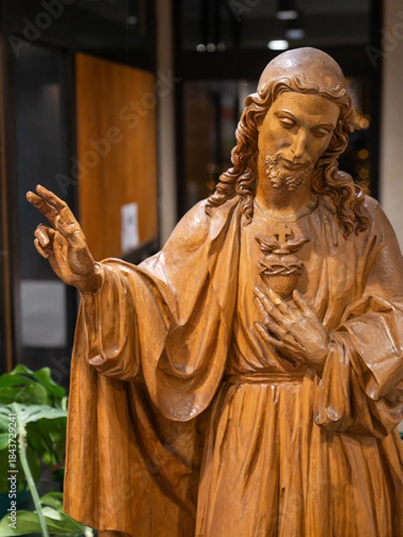 Fototapeta Beautiful Wood Carving of Jesus Christ without a cross but with thorns and the heart. High quality photo