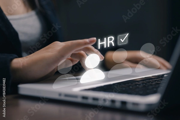 Obraz A human resources manager selects a candidate through a digital HR interface, representing recruitment, talent management, employee selection, workforce analytics, and human resource technology.