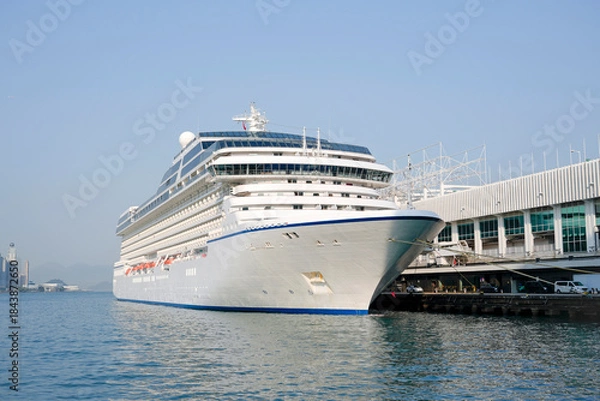 Obraz A cruise liner is a ship at the pier ready to set off on a long voyage.