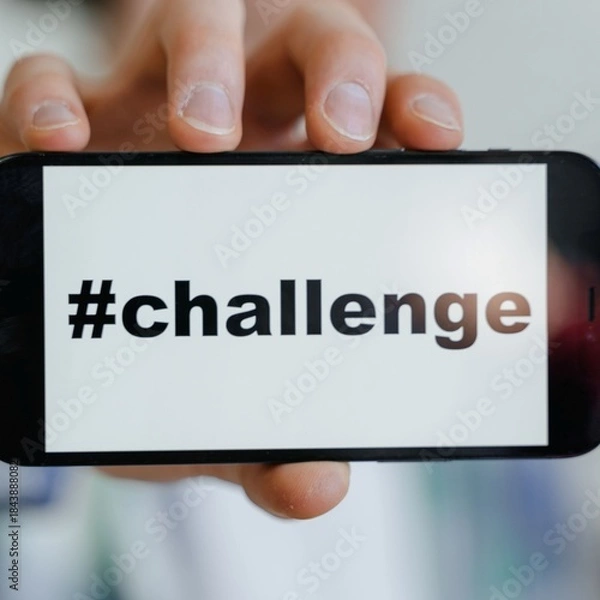 Fototapeta The picture shows the word 'challenge' on the cellphone.