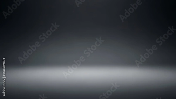 Fototapeta Empty studio backdrop with a spotlight creating a bright floor reflection