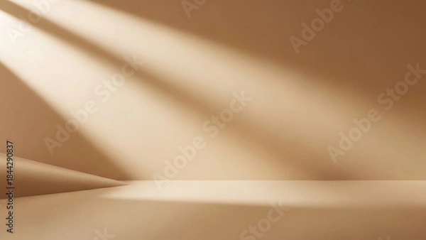 Fototapeta Warm light beams illuminate an empty, minimalist studio space, casting dynamic shadows across the neutral beige wall and floor, creating an elegant backdrop for product display or abstract concepts