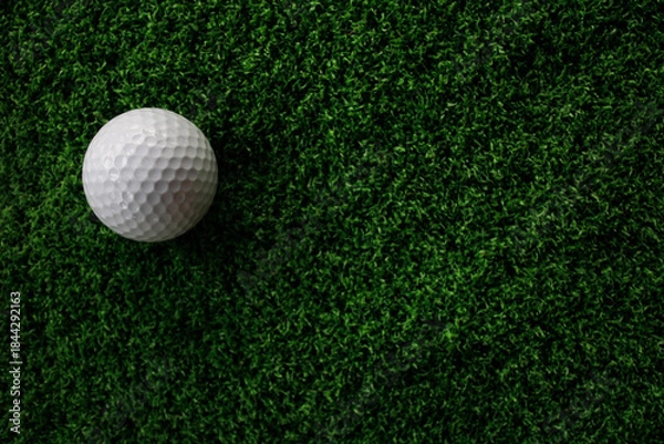 Obraz White Golf Ball on Artificial Turf Background with Green Texture