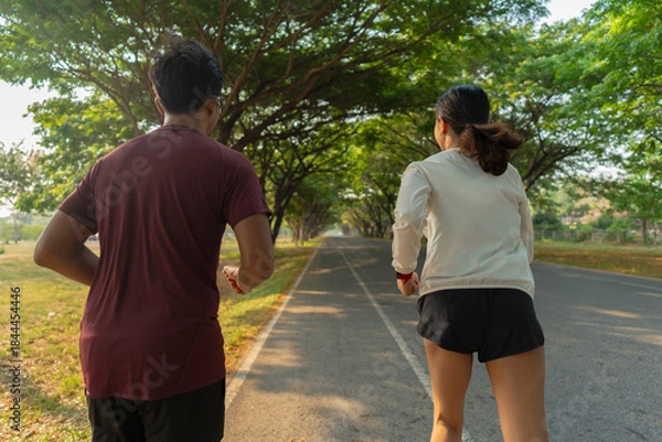 Fototapeta The couple went for a run and exercised in the morning.