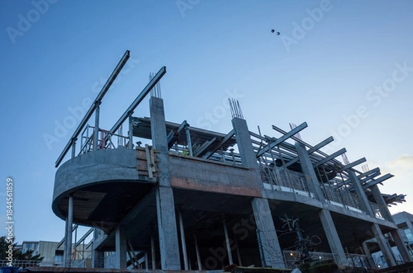 Obraz Building under construction at twilight