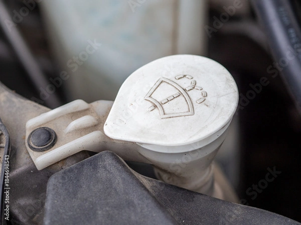 Fototapeta Car windshield washer fluid tank. The best windshield and headlight washer fluid. Car maintenance in winter conditions