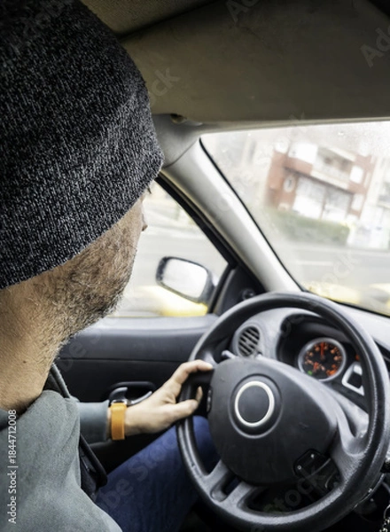 Obraz Man in a hat driving