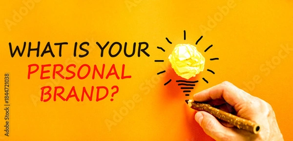 Fototapeta What is your personal brand symbol. Concept words What is your personal brand on beautiful orange paper. Beautiful orange paper background. Business what is your personal brand concept. Copy space.