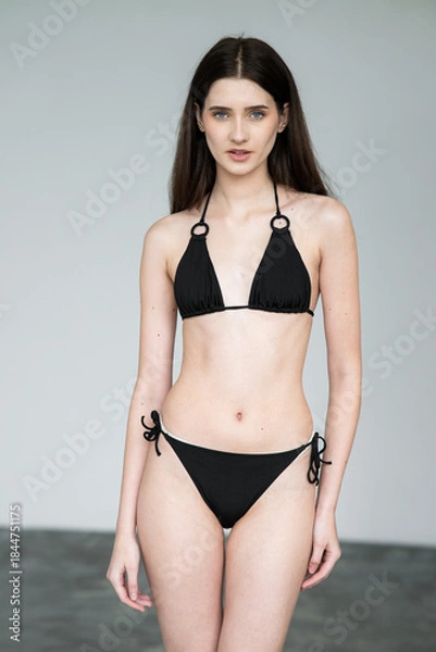 Obraz Natural emotional portrait of young woman model with expressive face, authentic beauty, lifestyle mood, clean skin, real emotions, modern female portrait photography in studio