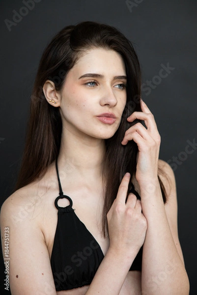 Obraz Natural emotional portrait of young woman model with expressive face, authentic beauty, lifestyle mood, clean skin, real emotions, modern female portrait photography in studio