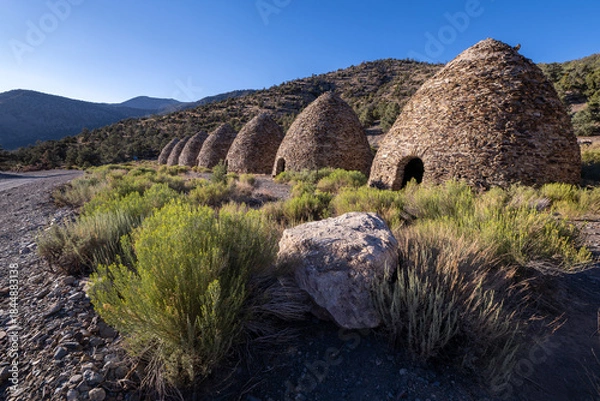 Fototapeta Row of Historic Charcoal Kilns Under Clear Blue Sky in Death Valley