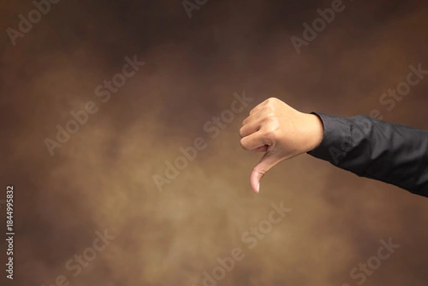 Obraz Negative thumb down gesture for feedback and rating.