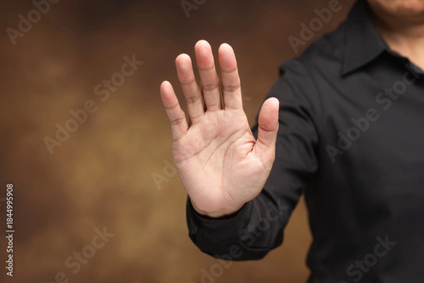 Obraz Stop hand gesture showing warning and protection concept.