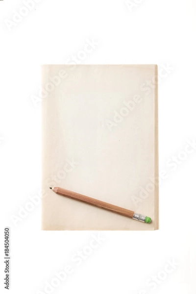Fototapeta vintage(old) note spread with pencil isolated on the white background.