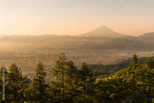 Fototapeta Mt.Fuji and Kofu city with sunrise sky seen from Mt. Amariyama view point.