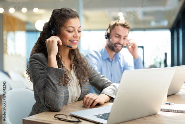 Obraz Friendly and helpful customer service support specialists in work.