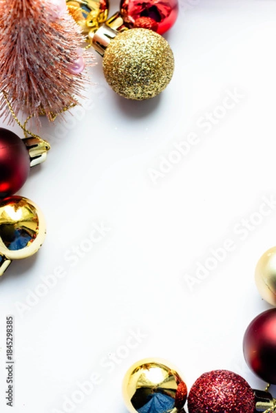 Fototapeta New Year background, bright red and gold balls on a white background, vertical frame