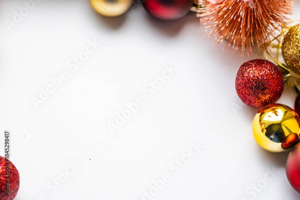Fototapeta New Year background, bright red and gold balls on a white background, horizontal frame