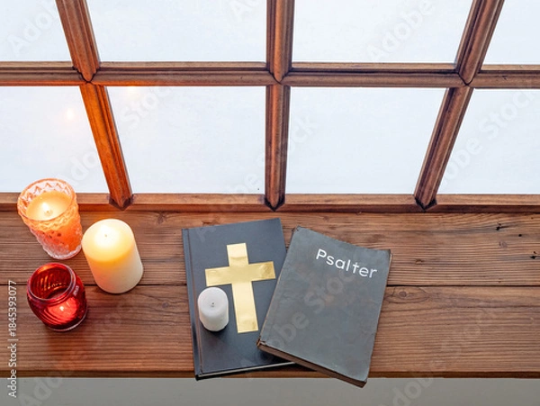 Obraz Holy bible, psalter and rosary beside old window in monastery