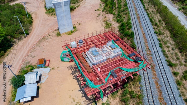 Fototapeta The concrete pillars/piers for the high-speed rail track are under construction at the unfinished construction site.