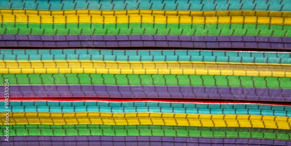 Fototapeta Stacked paper notebooks with colorful edges, creating a vibrant abstract background from layered pages