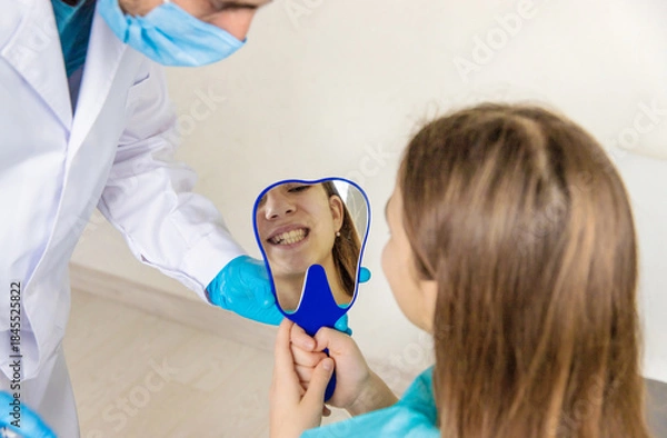 Obraz A child at the dentist gets his teeth treated. Selective focus.