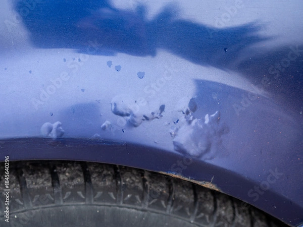 Fototapeta Car with peeling paint. Corrosion of metal under the paint. How to maintain a car body to prevent rust