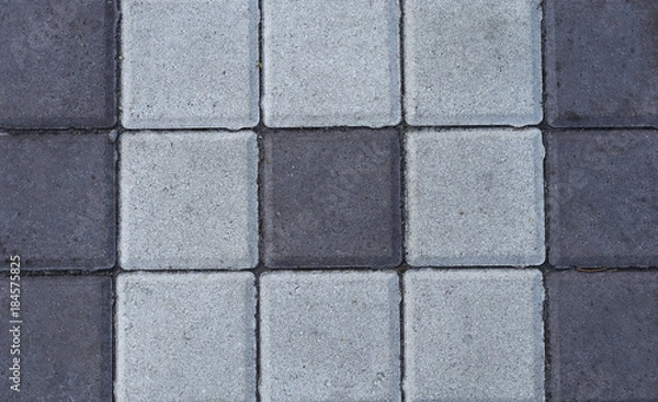 Fototapeta Stone paving tiles of different shapes and colors