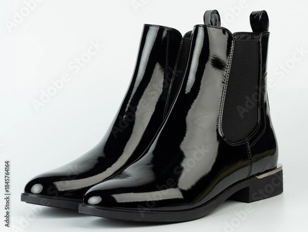 Obraz Stylish black boots placed on a plain surface for a clear view