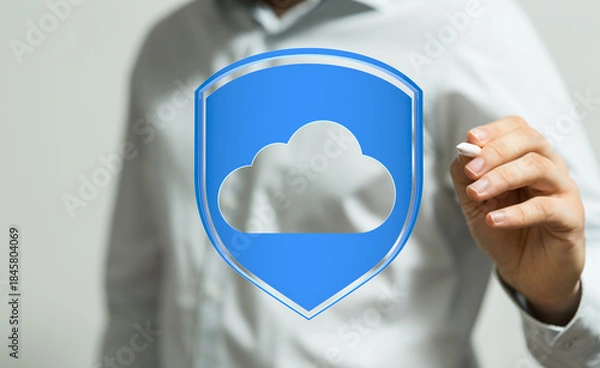 Obraz Secure cloud data protection concept, person touching a cloud inside a blue shield, representing privacy and on